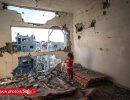A girl in her destroyed home, Gaza